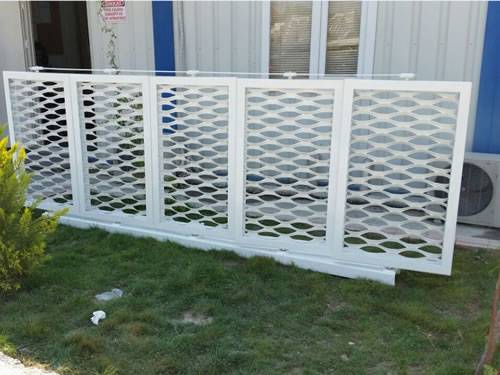 Five same white expanded metal infill panels combined together are used for decoration outdoor.