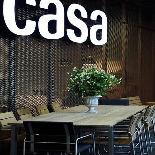 Raised expanded metal sheets as partition wall is used in restaurant of hotel.