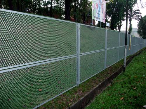 Raised expanded metal panels with diamond holes are installed on the fencing.