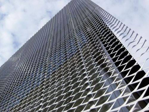 Galvanized aluminum expanded metal meshes with diamond holes are installed on the facades of office Building.
