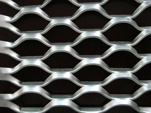 Hexagonal expanded metal sheet details with raised surface.
