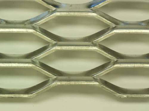 Stainless steel expanded metal details with hexagonal holes and raised surface.