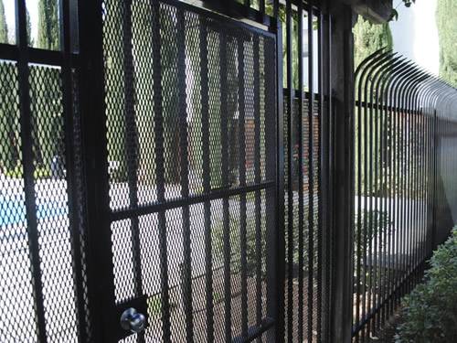 Expanded metal gate with black surface made of expanded metal meshes and metal tubes is used as fences.